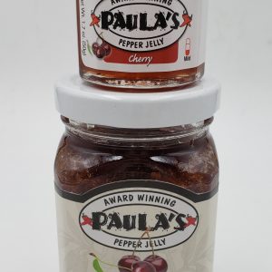 One of Paula’s 1.7 oz. pepper jelly jars stacked on top of the 8 oz. best pepper jelly jar from Paula’s Pepper Jelly.