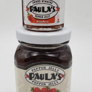 1.7 oz. strawberry pepper jelly jar on top of the 8 oz. Paula’s Pepper Jelly jar label-out.