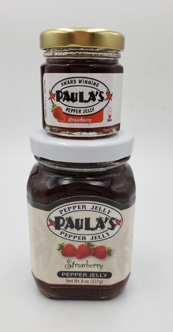 1.7 oz. strawberry pepper jelly jar on top of the 8 oz. Paula’s Pepper Jelly jar label-out.