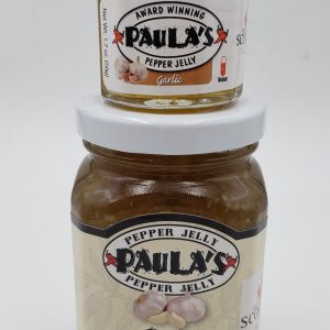 1.7 oz. Paula’s Pepper Jelly jar filled with garlic pepper jelly on top of an 8 oz. jar of organic jelly label side out.